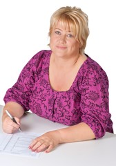 middle-aged woman signing some document