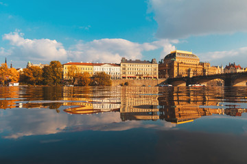 Prague city, embankment along the Vltava, reflected in the water