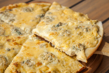 Pizza cheese on a wooden board