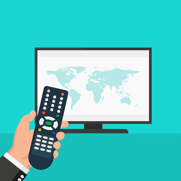 Hand holding wireless remote control near flat screen tv watching world news