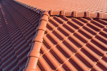 The roof of a high-rise building. Roof made of clay tiles. Environmentally friendly tiles. Roofing...