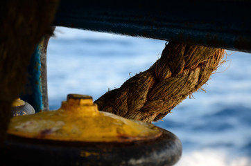 Mooring rope yellow bitt on a ferry boat