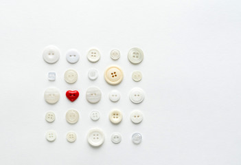 white buttons with red heart