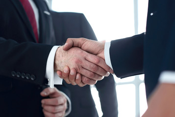 close up.business people shaking hands