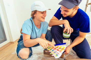 Man choose the right color for wooden furniture with his girlfriend