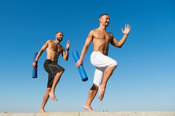 Obraz premium We always workout. Men do sport outdoor. Muscular men training on fresh air. Developing muscular strength in health club. Success in sport. Sport and health care. The success makes everything better