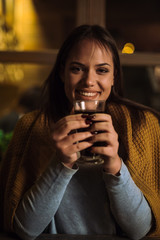 Happy woman holding tea