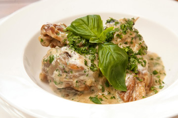 Meat and mushrooms with white sauce