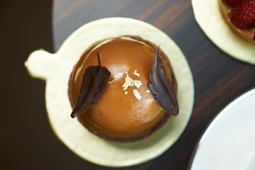 Berry cupcakes dessert on wooden table background, top view. Pieces of cream cake with strawberries and raspberries, sweets dessert breakfast snacks, close-up, copy space