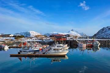 Fishing boats and yachts on pier in Norway