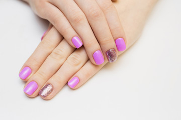 Nails varnishing in white color. Manicure, pedicure beauty salon concept. Empty place for text or logo.