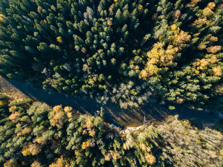 drone image. aerial view of wavy river in autumn colored forest