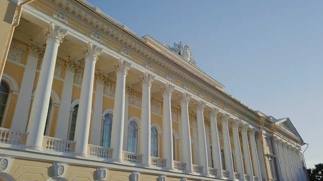 Russian Museum colomn view on a main building with sun setting down