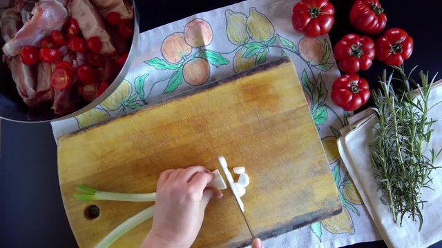 Woman Cuts Spring Onions