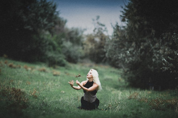 beautiful witch girl casts a spell