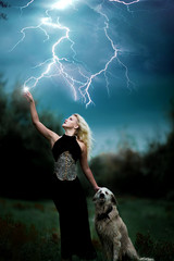beautiful witch girl controls lightning strike