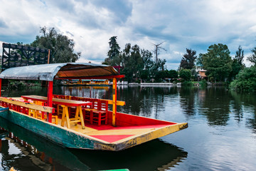 Mexican colorful trajineras on Xochimilco's lake.