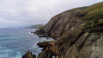 Fototapeta na wymiar Flight along the steep cliffs at Dingle Peninsula in Ireland