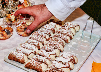 Let's party with many typical sicilian cannoli stuffed with ricotta cheese and candied