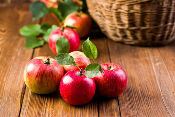 ripe apples on a wooden table in the garden
