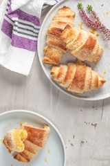 Tasty buttery croissants on plates