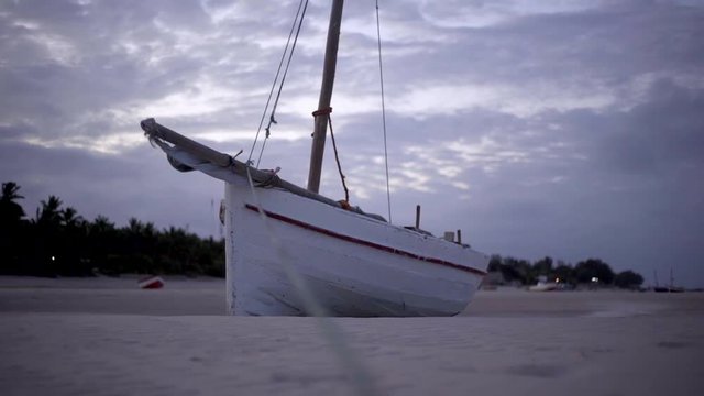 Boat Anchored in Sea Sand at Dusk in Vilankulos, Mozambique