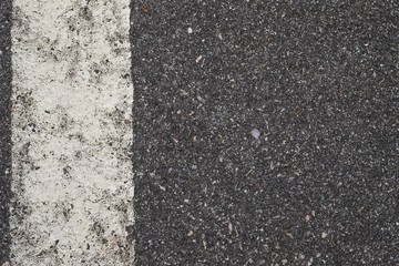 ASPHALT TEXTURE WITH WHITE SEPARATION LINE / TOP VIEW / FOR BACKGROUND