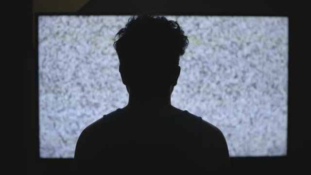 Man watching TV static (pull)