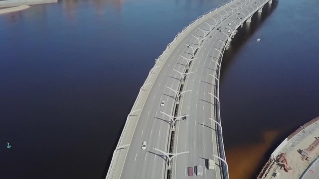 Big highway on a shore with cars passing by aerial view on Saint-Petersburg city panorama