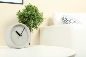 Analog clock on table indoors, space for text. Time management