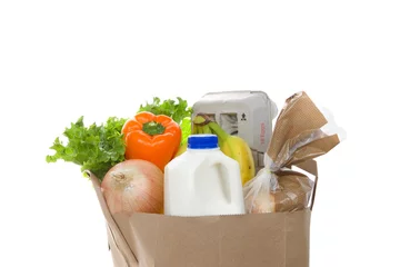 Fototapeten Brown eco friendly grocery bag with bottle of milk, carton of eggs, bag of bread, bananas, lettuce, bell pepper and onion, isolated on white. Healthy shopping. © sheilaf2002
