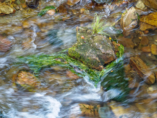 Little island in a fast flowing river - Villafranca del Bierzo, Castile and Leon, Spain