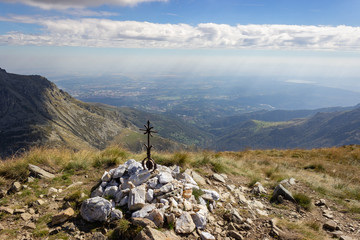Autumn hiking in Aosta valley, Gressoney, Italy. View of the city of Biella from Point Sella near...