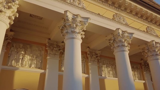 Russian Museum colomn view on a main building with sun setting down