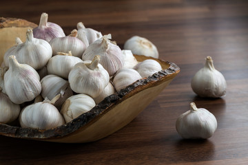 Garlic bulb in mango wooden tray