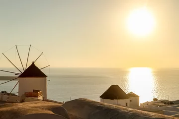 Photo sur Plexiglas Moulins Windmill against colorful sunset, Santorini