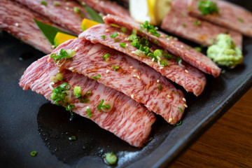 Closed up of premium Wagyu A5 sliced beef for yakiniku barbecue grill, japanese luxury meal, delicious plate with protein cousine