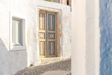 Traditional narrow street in the village Oia on Santorini Island