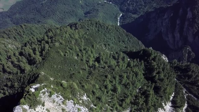 Aerial reveal type shot starting with a top view of Cima Vezzena, also called Pizzo di Levico, ending with with panoramic views of Trentino, Italy