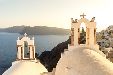 Archs with bells at church in Oia, island Santorini