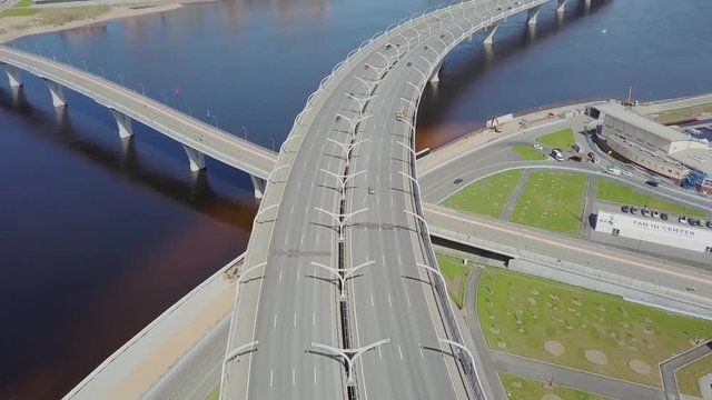 Big highway on a shore with cars passing by aerial view on Saint-Petersburg city panorama
