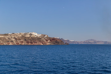 Fototapeta na wymiar Landscape of famous Santorini with white houses on hill