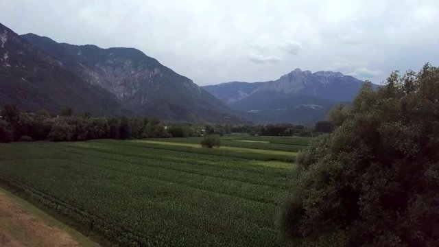 Aerial panoramic view of Levico Terme, Italy, during sunrise with views of the mountains.