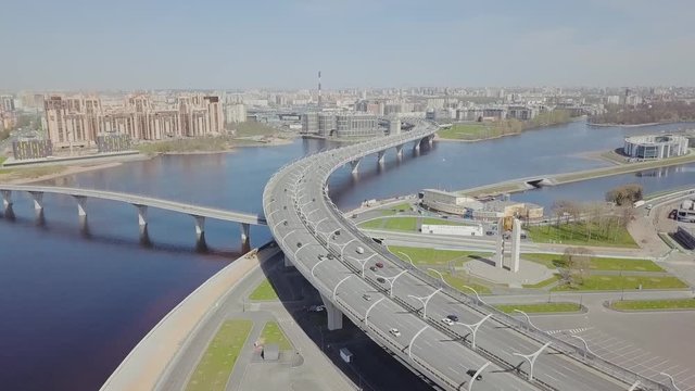 Big highway on a shore with cars passing by aerial view on Saint-Petersburg city panorama