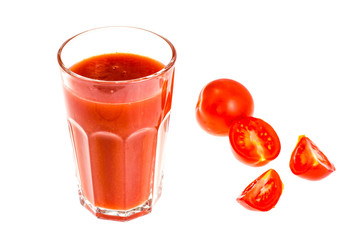 Glass of tomato juice on white background