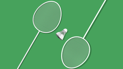 badminton racket and shuttlecock isolated on green