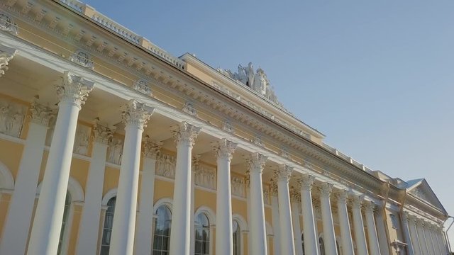 Russian Museum colomn view on a main building with sun setting down