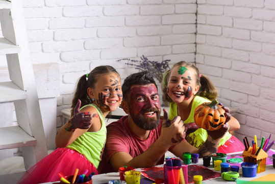 Halloween family with colorful paint.