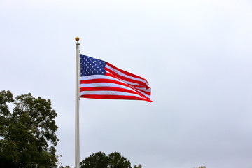 American Flag waving on pole