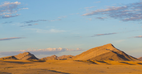 Fototapeta na wymiar Natural landscape at sunset in desert of Namibia